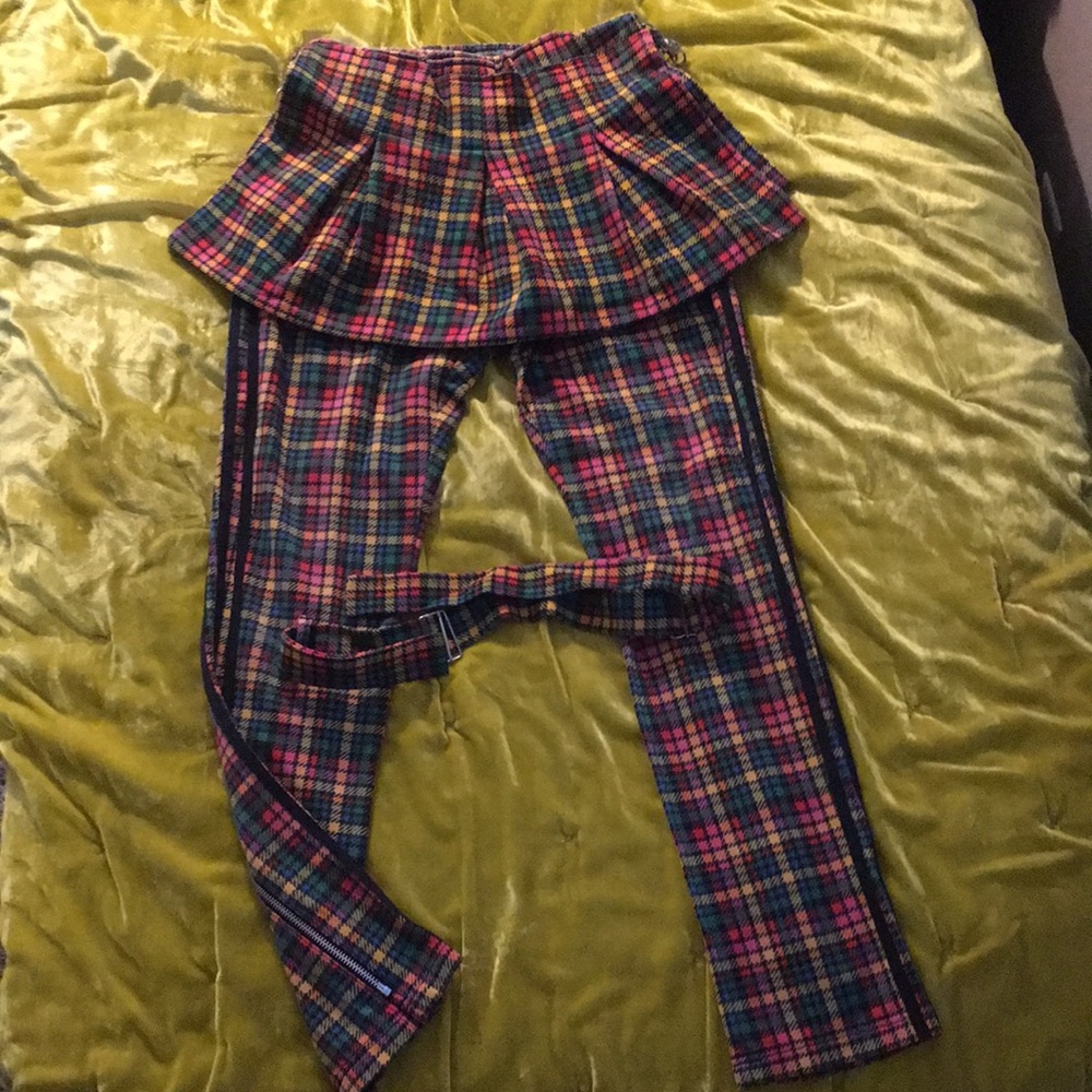 Jeremy Scott x Adidas plaid bondage pants.